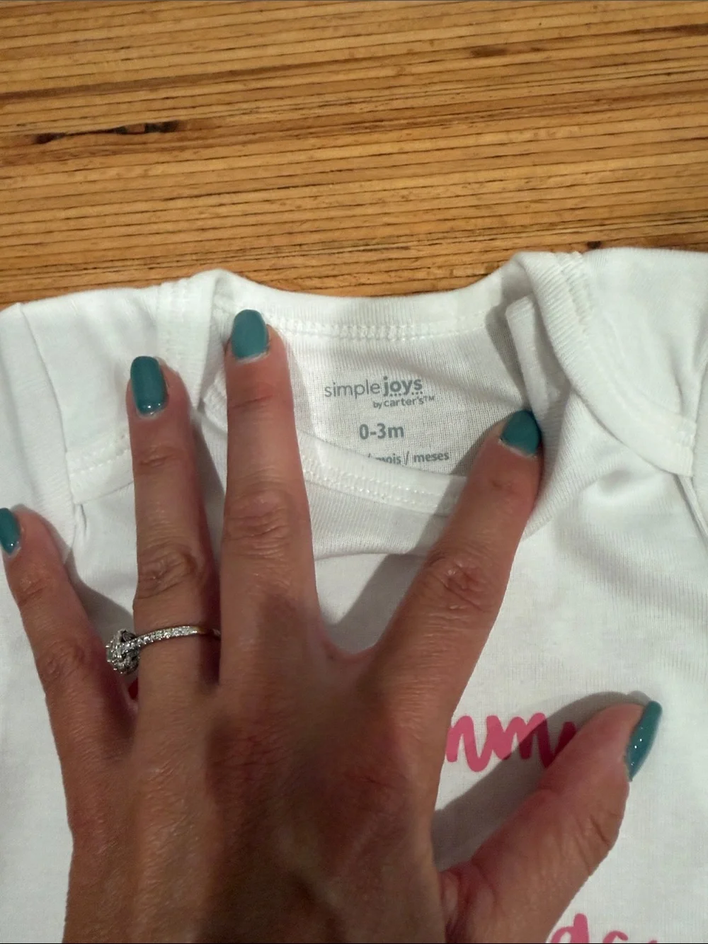 Simple White One-Piece with Pink Script Saying 